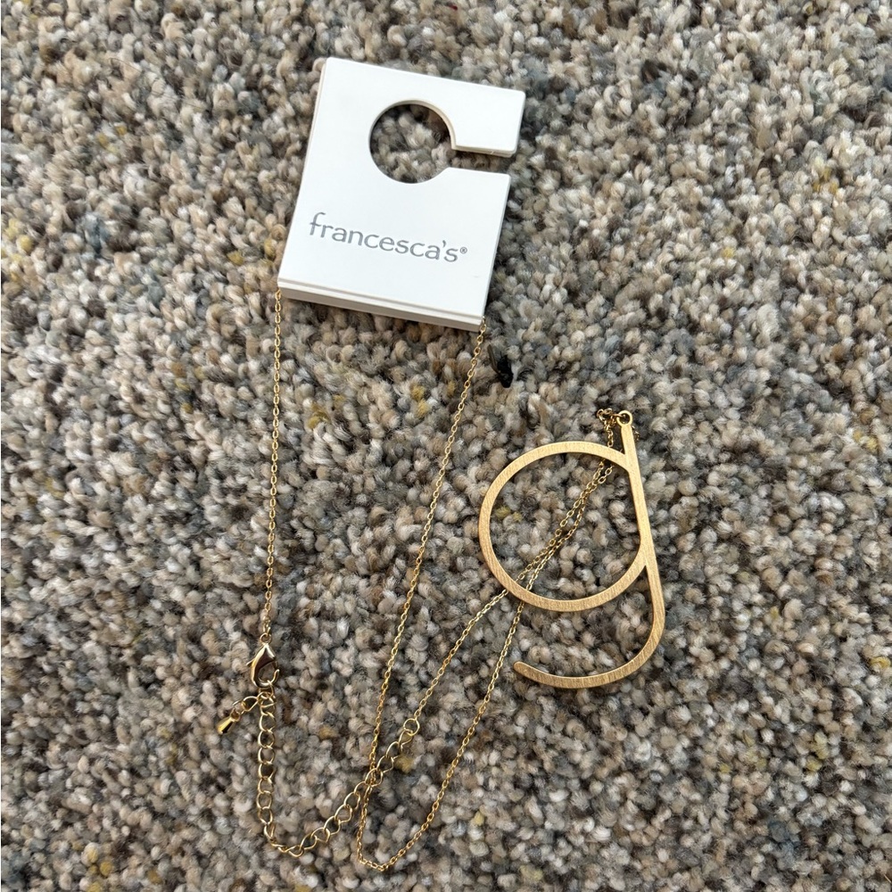 Never worn “G” necklace and earrings